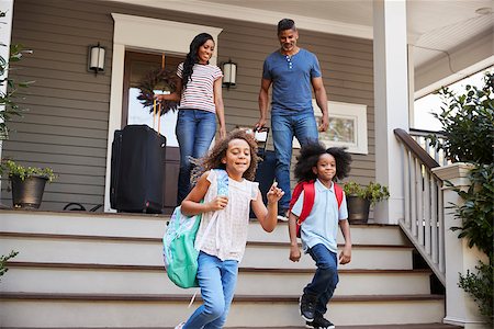 simsearch:400-09122233,k - Family With Luggage Leaving House For Vacation Stock Photo - Budget Royalty-Free & Subscription, Code: 400-09122225