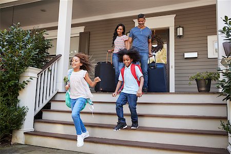 Family With Luggage Leaving House For Vacation Stock Photo - Budget Royalty-Free & Subscription, Code: 400-09122226