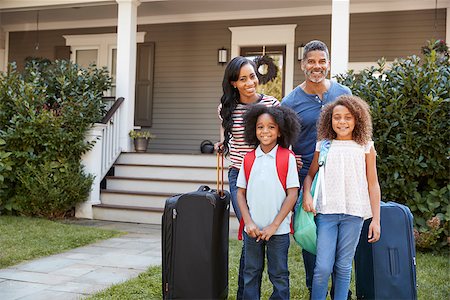 Portrait Of Family With Luggage Leaving House For Vacation Stock Photo - Budget Royalty-Free & Subscription, Code: 400-09122233
