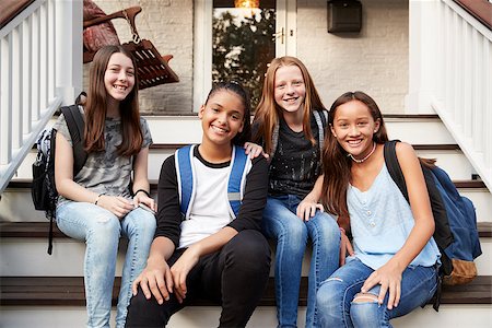 Young teen girls on front steps of house looking at camera Stock Photo - Budget Royalty-Free & Subscription, Code: 400-09122425