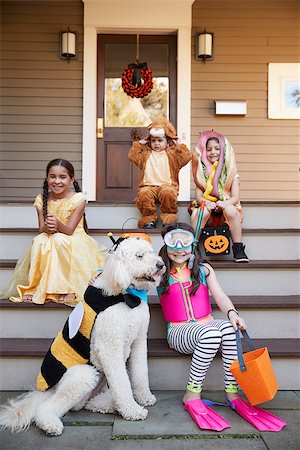 Children And Dog In Halloween Costumes For Trick Or Treating Stock Photo - Budget Royalty-Free & Subscription, Code: 400-09122597