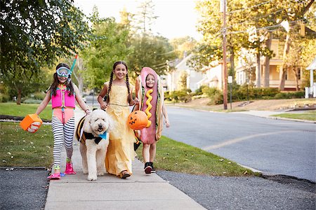 Children And Dog In Halloween Costumes For Trick Or Treating Stock Photo - Budget Royalty-Free & Subscription, Code: 400-09122608