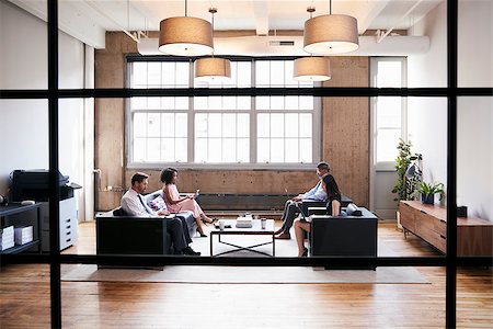 Business people in lounge meeting area, seen through window Stock Photo - Budget Royalty-Free & Subscription, Code: 400-09122746