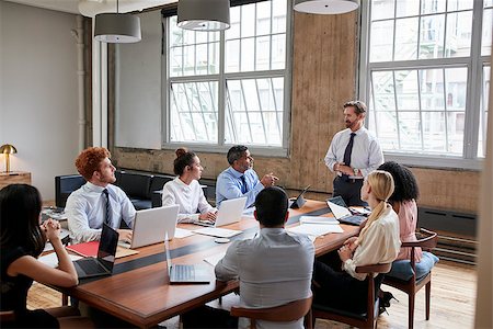 simsearch:400-08838985,k - Bearded businessman addressing colleagues at a board meeting Stock Photo - Budget Royalty-Free & Subscription, Code: 400-09122805