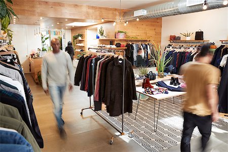 People walking through a busy clothes shop, motion blur Stock Photo - Budget Royalty-Free & Subscription, Code: 400-09122929