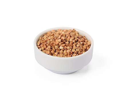 simsearch:400-06556120,k - Buckwheat groats in whitebowl isolated on white background. Fotografie stock - Microstock e Abbonamento, Codice: 400-09136189