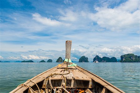 simsearch:400-09010275,k - close-up of a Thai wooden boat sailing to beautiful rocks at sea, Thailand, view of Krabi Island Photographie de stock - Aubaine LD & Abonnement, Code: 400-09136193