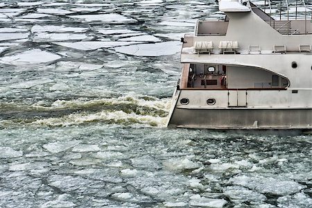 Stern of ship sailing along a river covered with a broken ice in early spring Stock Photo - Budget Royalty-Free & Subscription, Code: 400-09136600