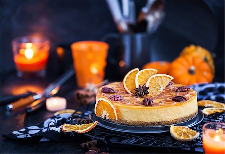 simsearch:400-06429990,k - Delicious pumpkin and orange cheesecake decorated with caramel sauce and pecan Stock Photo - Budget Royalty-Free & Subscription, Code: 400-09131914