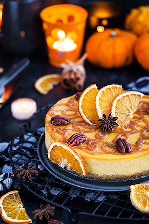 simsearch:400-06429990,k - Delicious pumpkin and orange cheesecake decorated with caramel sauce and pecan Stock Photo - Budget Royalty-Free & Subscription, Code: 400-09131912