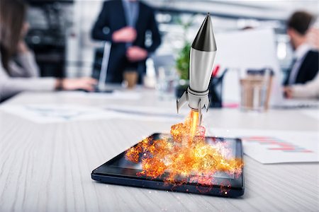 simsearch:400-09112433,k - Fast rocket ready to starts from a tablet. concept of company startup Stockbilder - Microstock & Abonnement, Bildnummer: 400-09132052