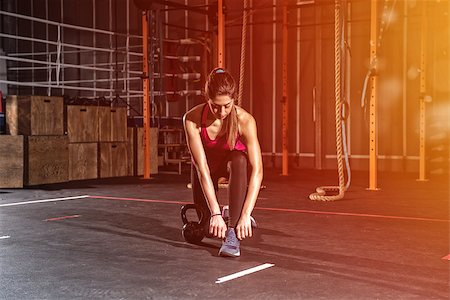 simsearch:400-08505882,k - Determined athletic girl ready to start exercises with a kettlebell at the gym Stock Photo - Budget Royalty-Free & Subscription, Code: 400-09132153
