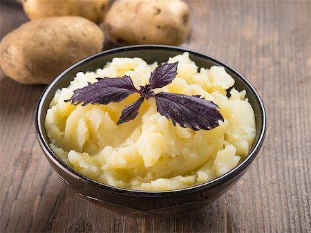 fascinadora (artist) - Mashed potatoes with fresh red basil in dark bowl on wooden background. Copy space. Stock Photo - Budget Royalty-Free & Subscription, Code: 400-09132238