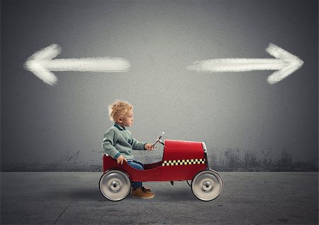 simsearch:400-04324276,k - Difficult choices of a young businessman on a toy car. concept of confusion Stockbilder - Microstock & Abonnement, Bildnummer: 400-09132685