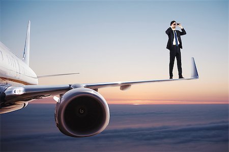 Businessman with binoculars over a fast aircraft searches for new business opportunities Stock Photo - Budget Royalty-Free & Subscription, Code: 400-09132698