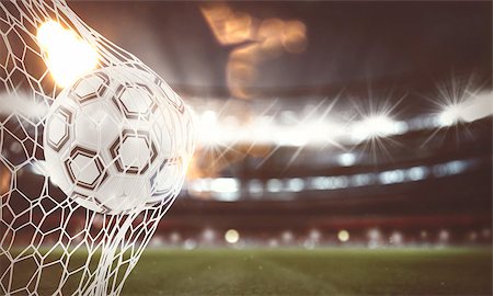 simsearch:400-09083466,k - Soccer ball pierces the soccer goal at the stadium during a night match. 3D Rendering Foto de stock - Super Valor sin royalties y Suscripción, Código: 400-09132759