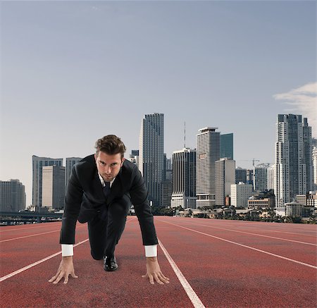 simsearch:400-09220882,k - Businessman acts like a runner on a track. Competition and challenge in business concept Photographie de stock - Aubaine LD & Abonnement, Code: 400-09132773