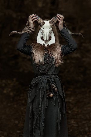 fotolit (artist) - Witch in a long black dress walking through the village in the dark Foto de stock - Royalty-Free Super Valor e Assinatura, Número: 400-09132996