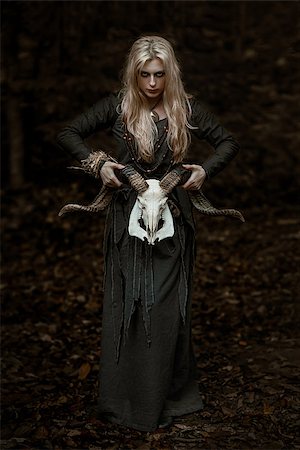 sacrifice - Witch in a long black dress walking through the village in the dark Photographie de stock - Aubaine LD & Abonnement, Code: 400-09132997