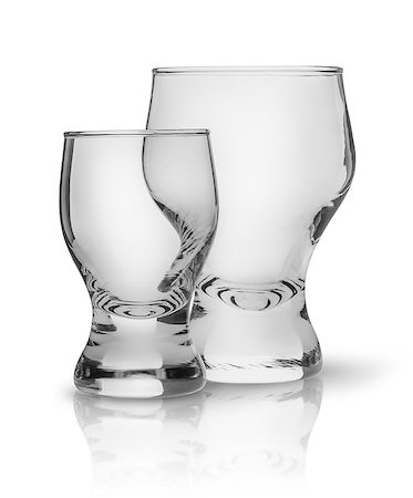Two glasses side by side. Big and small glasses one after another. Isolated on white background. Stock Photo - Budget Royalty-Free & Subscription, Code: 400-09140545