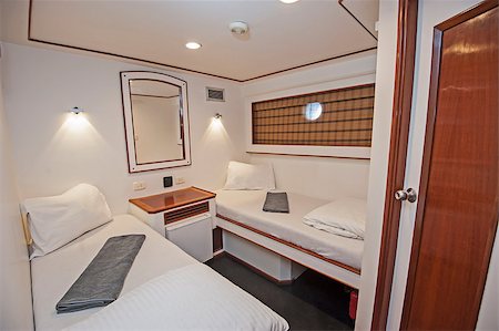 Twin beds in cabin of a luxury private motor yacht Stock Photo - Budget Royalty-Free & Subscription, Code: 400-09140712