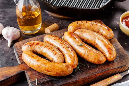 pan to the fire - BBQ sausages with herbs and spices, rustic style. Stock Photo - Budget Royalty-Free & Subscription, Code: 400-09151130