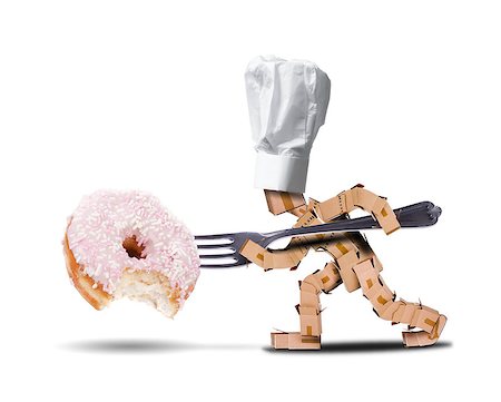 Chef box character with hat and a large fork attacking a large donut witha bite taken out of it. White background diet and food concept Foto de stock - Royalty-Free Super Valor e Assinatura, Número: 400-09170553