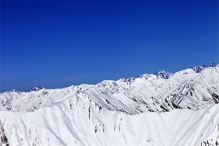 simsearch:400-08671175,k - Winter snow mountains and blue clear sky. Caucasus Mountains, Georgia, region Gudauri. Stock Photo - Budget Royalty-Free & Subscription, Code: 400-09170737