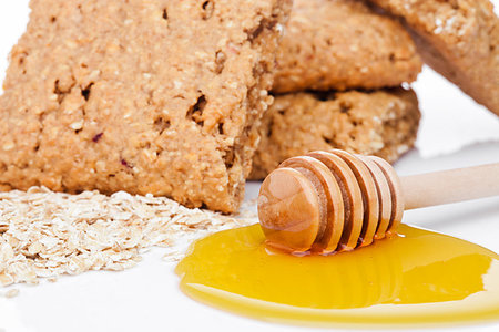 simsearch:400-09186057,k - Healthy bio breakfast grain biscuits with honey and raw oat porridge on white background Foto de stock - Super Valor sin royalties y Suscripción, Código: 400-09185917