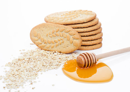 simsearch:400-09186057,k - Healthy bio breakfast grain biscuits with honey and raw oat porridge on white background Foto de stock - Super Valor sin royalties y Suscripción, Código: 400-09185918