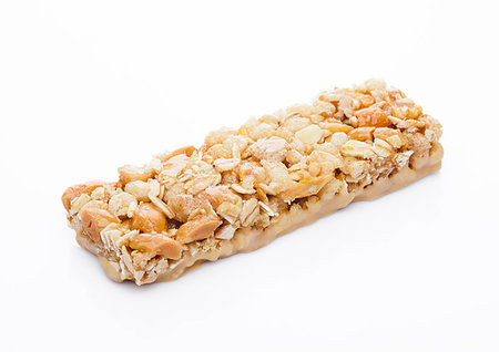 simsearch:400-09186057,k - Honey protein cereal energy bar with peanuts on white background Foto de stock - Super Valor sin royalties y Suscripción, Código: 400-09185920