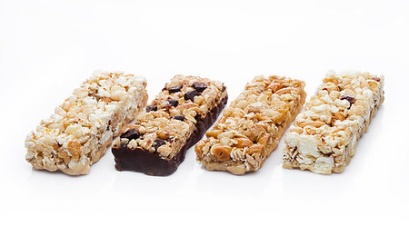 simsearch:400-09238081,k - Protein cereal energy bars with nuts and caramel and chocolate for breakfast on white background Photographie de stock - Aubaine LD & Abonnement, Code: 400-09185957