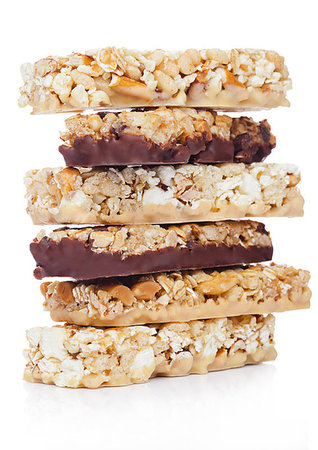 simsearch:400-09238081,k - Protein cereal energy bars with nuts and caramel and chocolate for breakfast on white background Photographie de stock - Aubaine LD & Abonnement, Code: 400-09185959