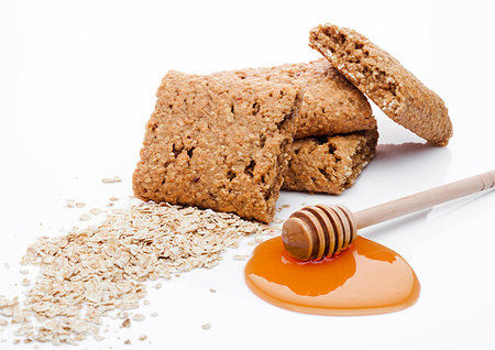 simsearch:400-07212397,k - Healthy bio breakfast grain biscuits with honey and raw oat porridge on white background Foto de stock - Super Valor sin royalties y Suscripción, Código: 400-09185952