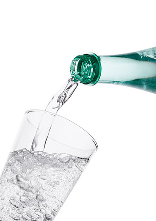soda, fizz - Pouring sparkling mineral water from bottle to glass on white background Stock Photo - Budget Royalty-Free & Subscription, Code: 400-09186010