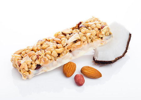 simsearch:400-09186057,k - Coconut protein cereal energy bar with almonds on white background Foto de stock - Super Valor sin royalties y Suscripción, Código: 400-09186011