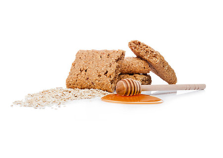 simsearch:400-09186057,k - Healthy bio breakfast grain biscuits with honey and raw oat porridge on white background Foto de stock - Super Valor sin royalties y Suscripción, Código: 400-09186050