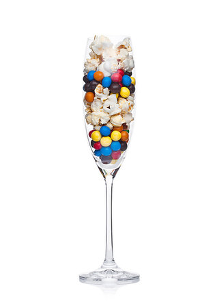simsearch:400-04781520,k - Popcorn and round chocolate candies in glass on white background Photographie de stock - Aubaine LD & Abonnement, Code: 400-09186069