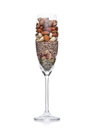 simsearch:400-07224405,k - Glass with healthy organic nuts almonds and cashew and pumpkin and sunflower seeds on white background Photographie de stock - Aubaine LD & Abonnement, Code: 400-09186075
