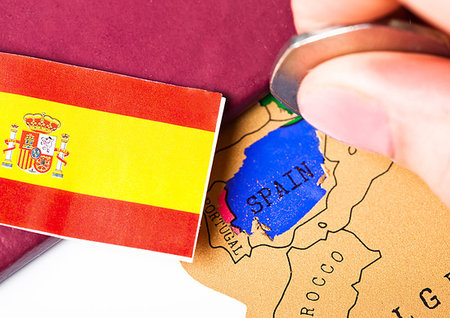 simsearch:400-09186100,k - Travel holiday to Spain concept with passport and flag with female hand choosing Spain on the map Stock Photo - Budget Royalty-Free & Subscription, Code: 400-09186084