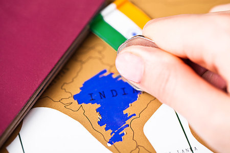 simsearch:400-09186100,k - Travel holiday to India concept with passport and flag with female hand choosing India on the map Stock Photo - Budget Royalty-Free & Subscription, Code: 400-09186095