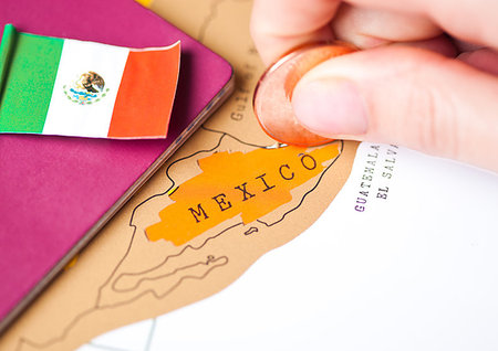 simsearch:400-09186100,k - Travel holiday to Mexico concept with passport and flag with female hand choosing Mexico on the map Stock Photo - Budget Royalty-Free & Subscription, Code: 400-09186090