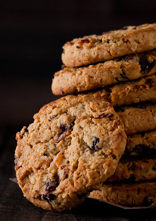 Gluten free oatmeal chocolate cookies with rasins on a old wooden background Stock Photo - Budget Royalty-Free & Subscription, Code: 400-09186163