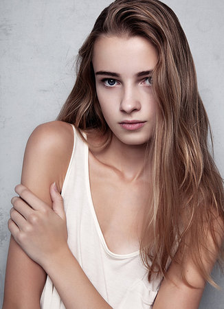 denismart (artist) - Model test with young beautiful fashion model wearing white t-shirt in studio.Color portrait Foto de stock - Royalty-Free Super Valor e Assinatura, Número: 400-09186286