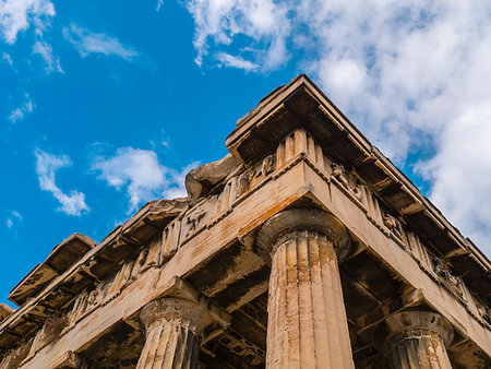 simsearch:400-05909439,k - Ruins of the Greek building. Close up of ancient Greco-Roman columns. Close up low angle architectural view of ancient Greek ruins. Sunny day with clear blue sky in olympia, Greece. Foto de stock - Super Valor sin royalties y Suscripción, Código: 400-09186407