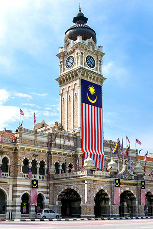 Sultan Abdul Samad Building with clock-tower and malaysian flag, Kuala Lumpur, Malaysia Stock Photo - Budget Royalty-Free & Subscription, Code: 400-09193396
