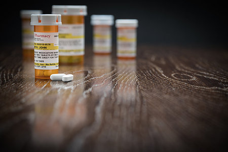 simsearch:400-08862116,k - Variety of Non-Proprietary Prescription Medicine Bottles and Pills on Reflective Wooden Surface. Stock Photo - Budget Royalty-Free & Subscription, Code: 400-09193460