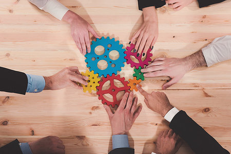 simsearch:400-08669915,k - Teamwork of businesspeople work together and combine pieces of gears. Partnership and integration concept Stock Photo - Budget Royalty-Free & Subscription, Code: 400-09224331