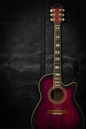 shadow acoustic guitar - Photo of a purple acoustic guitar leaning up against a dark metal background. Stock Photo - Budget Royalty-Free & Subscription, Code: 400-09224997