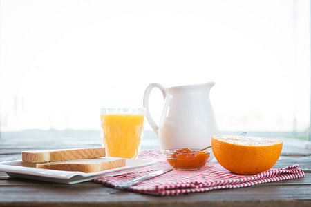 Healthy english breakfast with toasts, orange juice and jam on the table close up Stock Photo - Budget Royalty-Free & Subscription, Code: 400-09225823